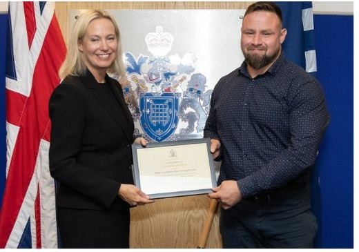 Trustify's Head of Forensics receiving a commendation